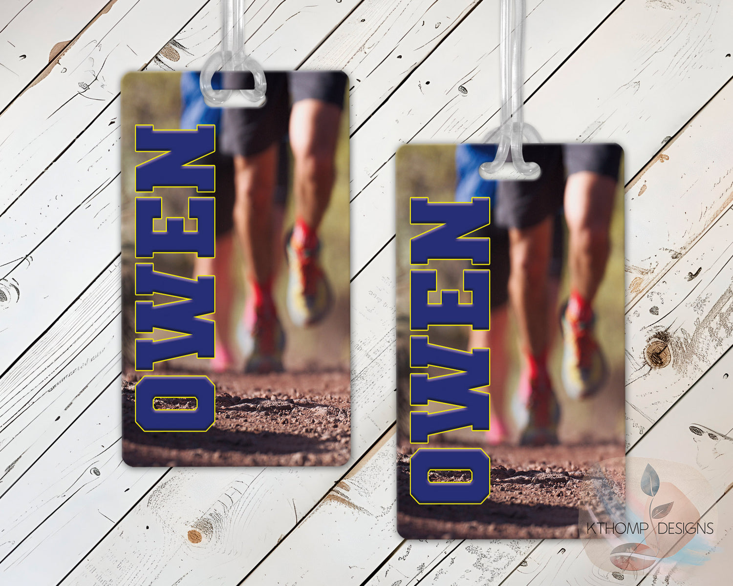 Cross country bag tags with runner name shown on a wood background