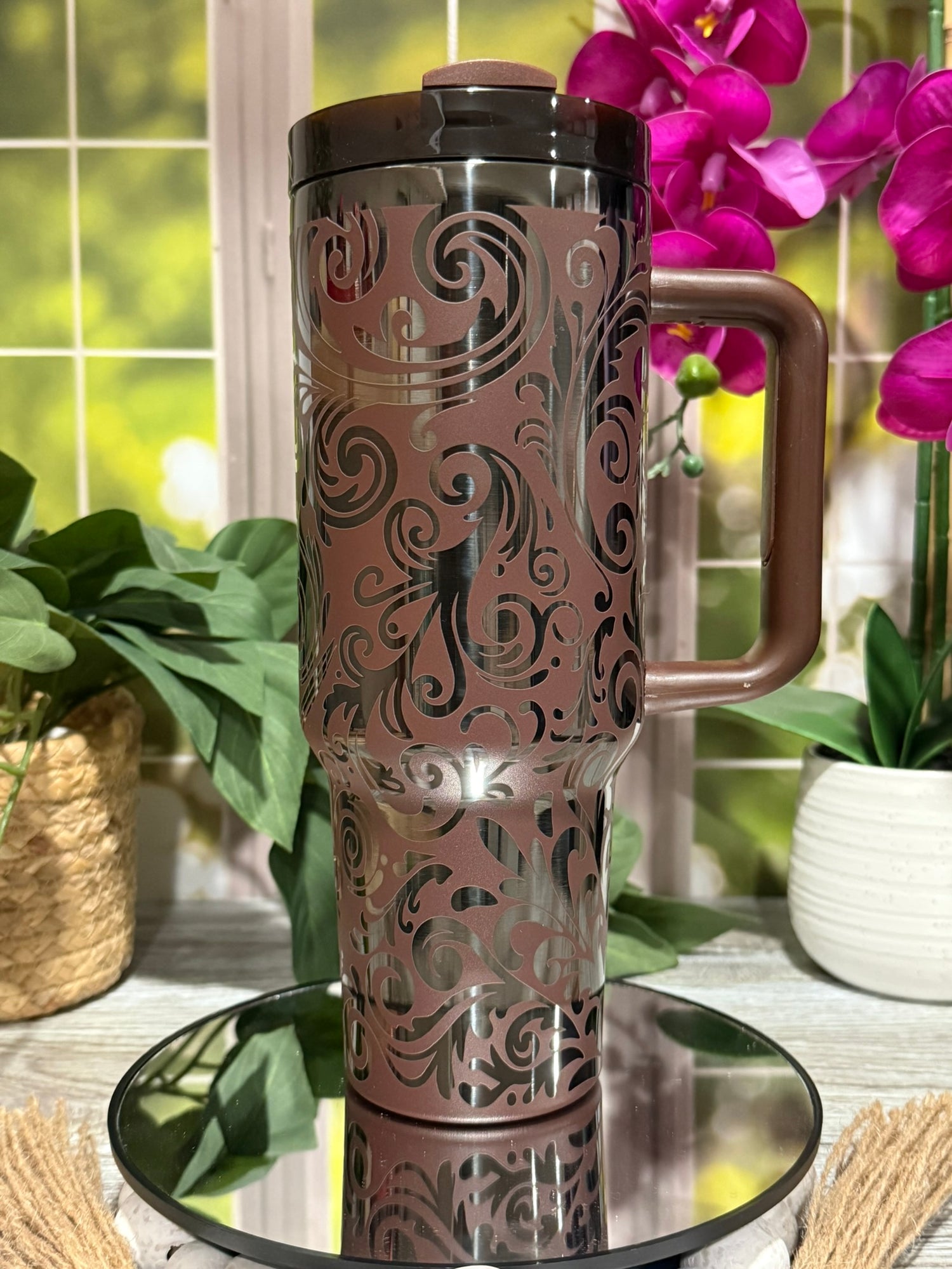 40oz Chocolate Onyx stainless steel tumbler cup with handle, laser engraved with tooled leather western scroll design and polished black base finish – ready to ship.
