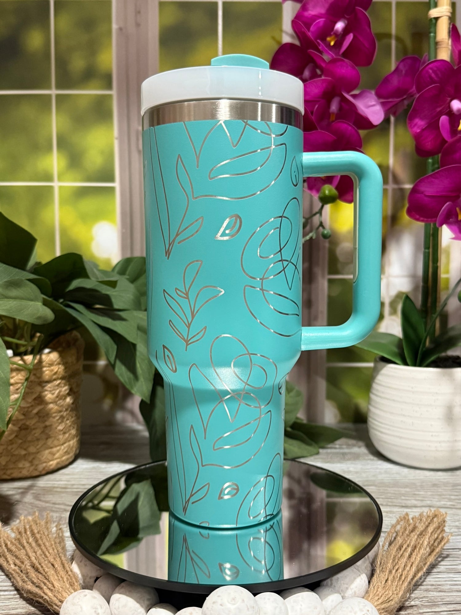 40oz teal stainless steel tumbler cup with handle, laser engraved with abstract floral line art design – ready to ship.