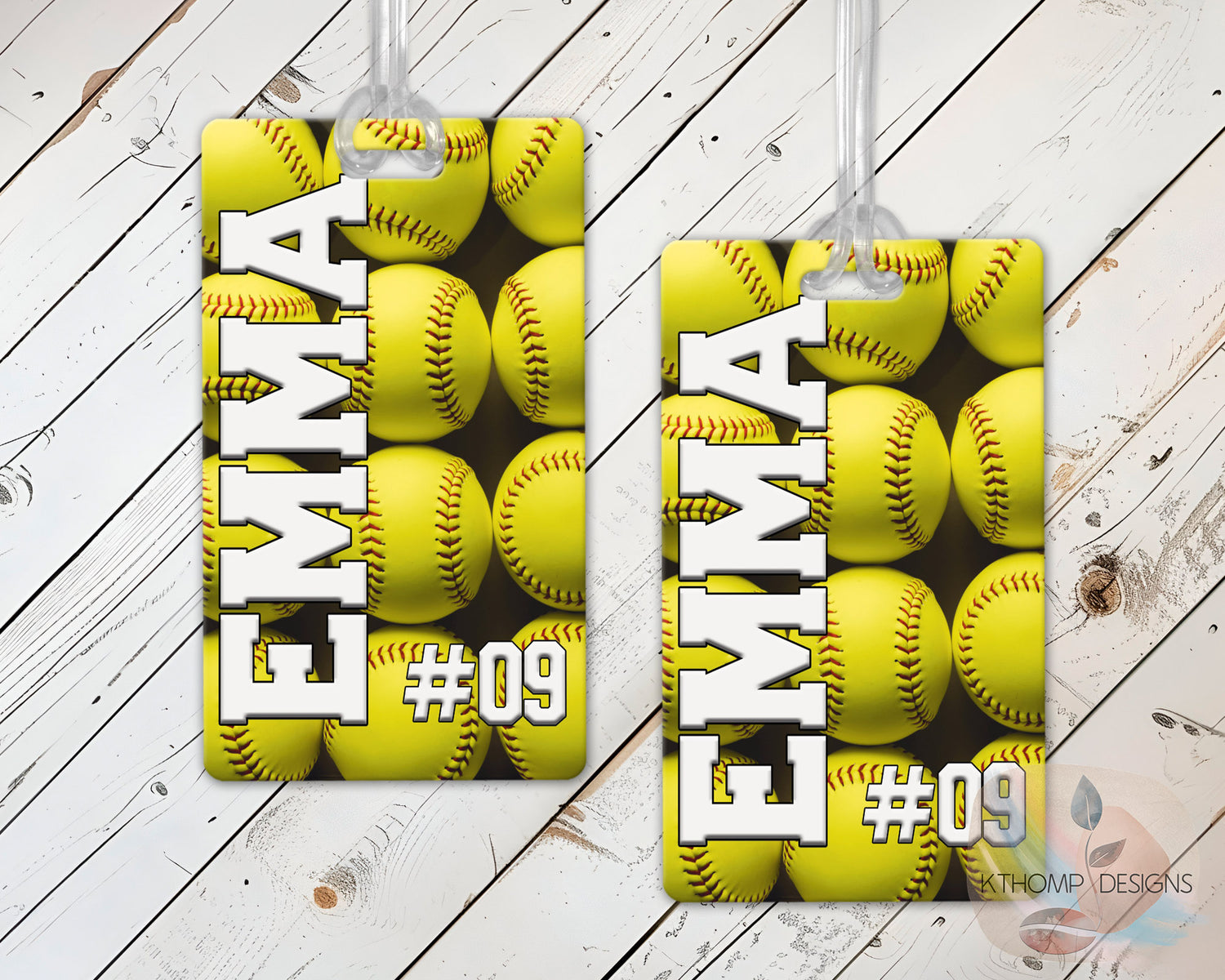 Personalized softball sports bag tags with player name and number on a wood background
