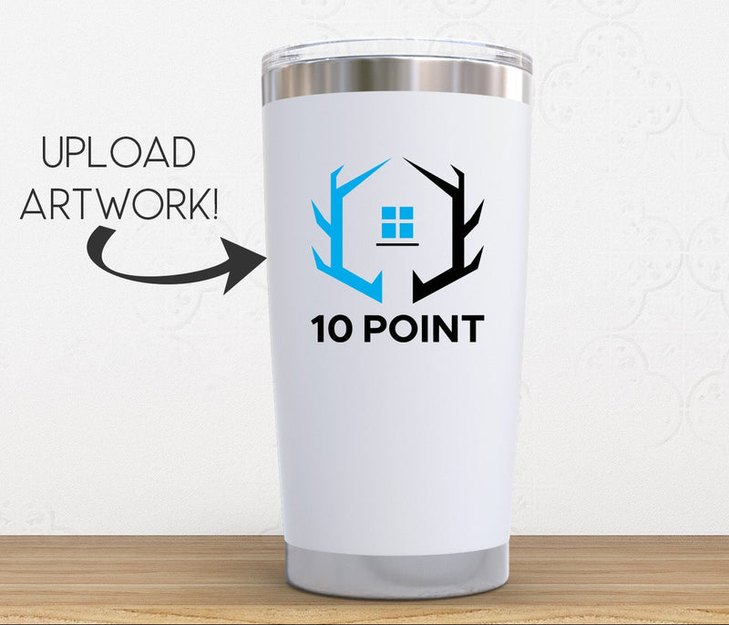 A white insulated travel tumbler with a stainless steel lid sits on a wooden surface against a light gray wall. The tumbler displays a custom graphic with a blue and black house logo and the text '10 POINT'.