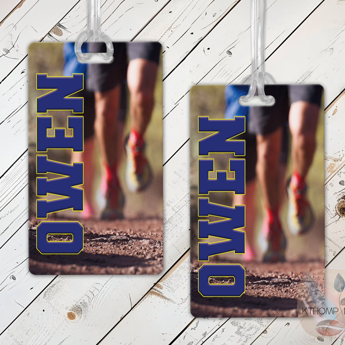 Cross country bag tags with runner name shown on a wood background