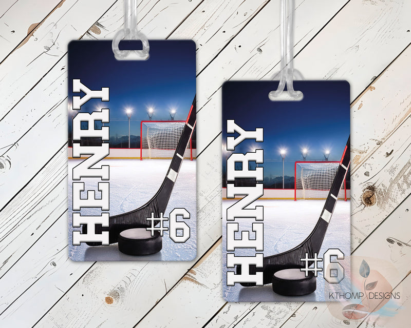 Two hockey-themed name tags with name and number on a wooden surface.