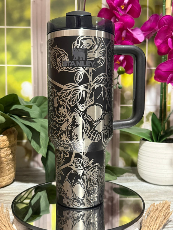 40oz Black Stanley tumbler cup with handle, laser engraved with Skulls & Cuss Words design including skulls, roses, and hidden text – ready to ship.