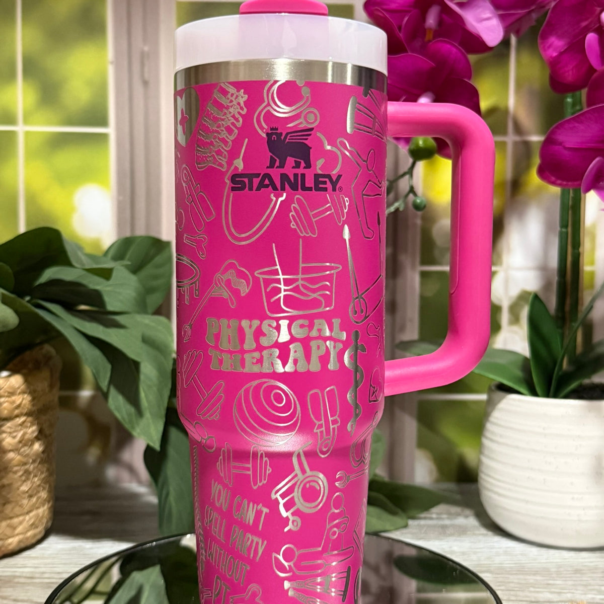 30oz Stanley Fuchsia tumbler cup with handle, laser engraved with Physical Therapy design including PT icons and phrase “You can’t spell party without PT” – ready to ship.