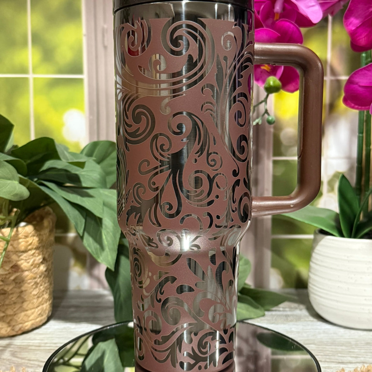 40oz Chocolate Onyx stainless steel tumbler cup with handle, laser engraved with tooled leather western scroll design and polished black base finish – ready to ship.