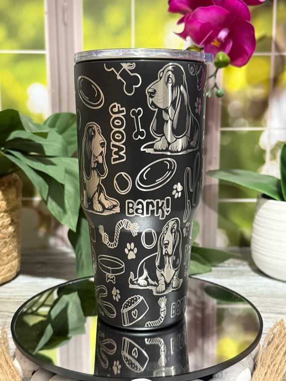 30oz black stainless steel tumbler cup without handle, laser engraved with Basset Hound doodles, paw prints, and bones – ready to ship.