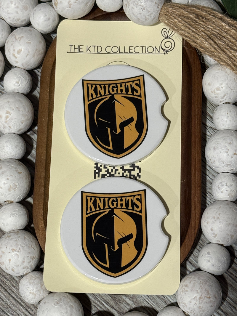 Set of two ceramic car coasters with Canandaigua Knights logo, displayed on The KTD Collection packaging with white beaded accents