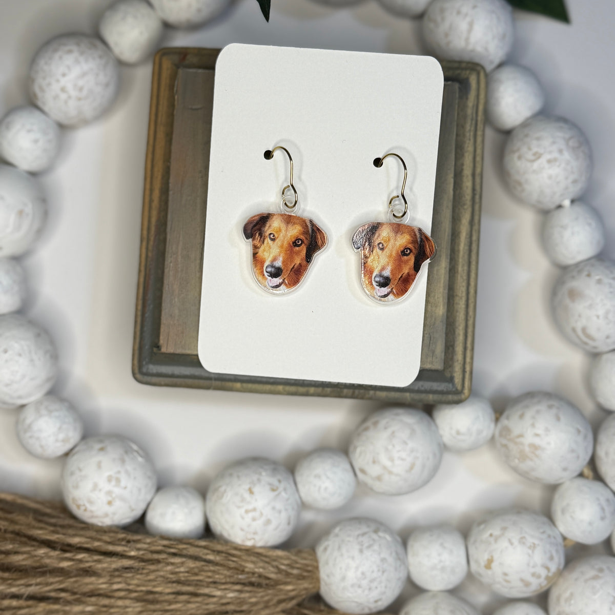 UV printed acrylic earrings shaped like a pet's face, shown with dog photo