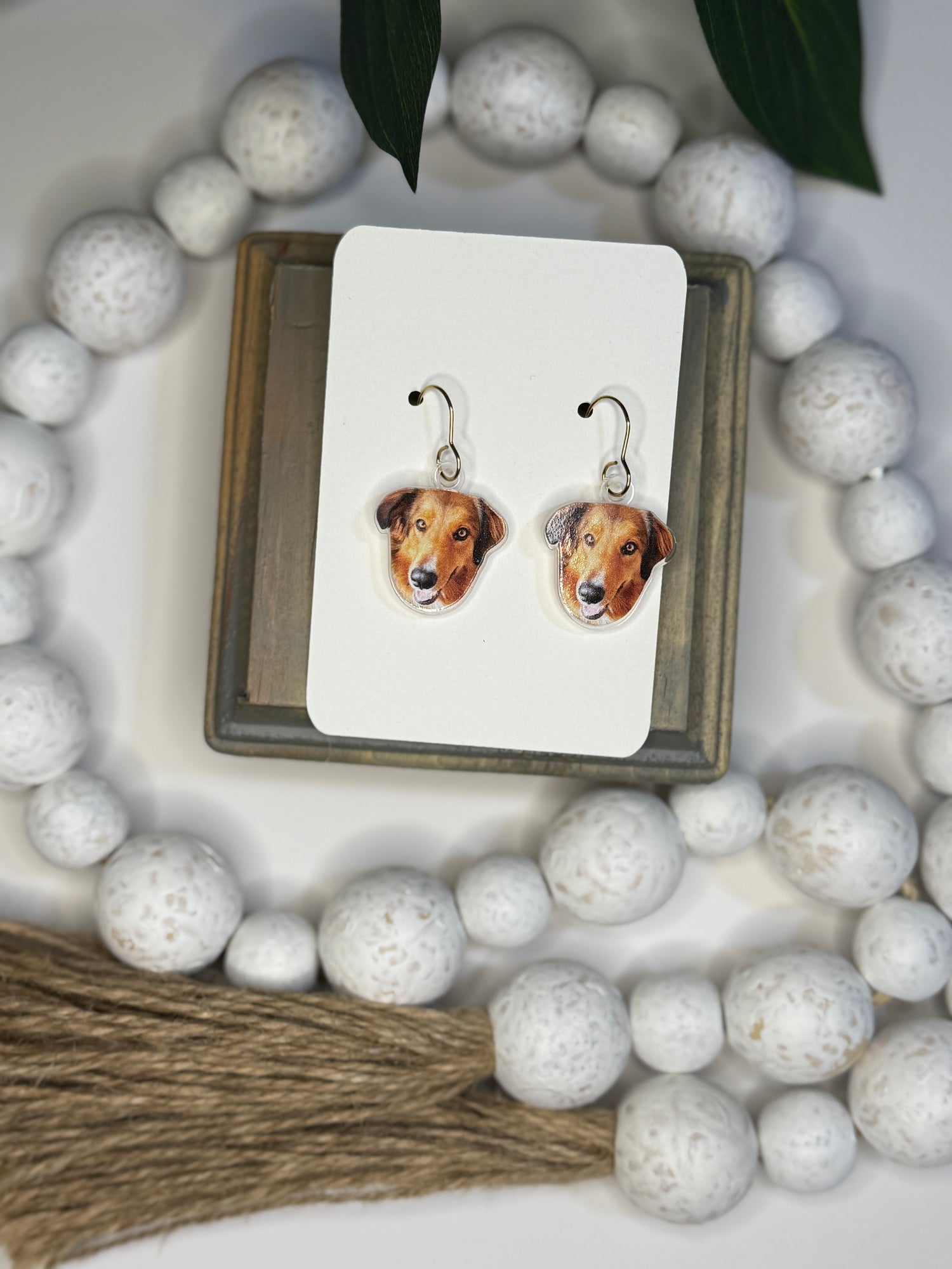 UV printed acrylic earrings shaped like a pet's face, shown with dog photo