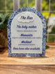 Decorative bar menu with blue floral design on a wooden surface