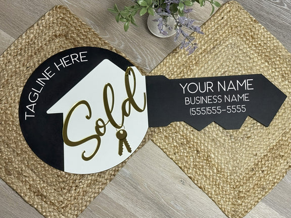 Custom acrylic key sign for real estate agents with personalized name, logo, and QR code, used as a photo prop for closings and branding