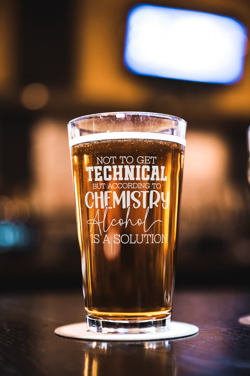 Laser engraved alcohol-themed pint glass with funny saying, displayed on wood surface—perfect gift for men, groomsmen, or beer enthusiasts