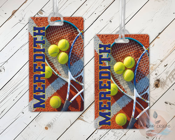 Tennis-themed sports bag tags with player's name on a wood background
