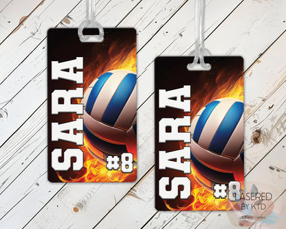Custom volleyball bag tags with name and jersey number on a wood background