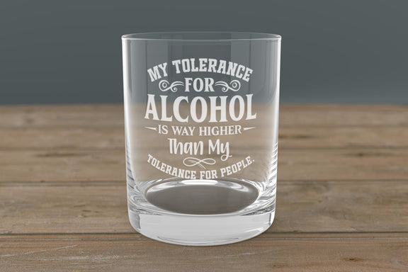 Laser engraved alcohol-themed whiskey glass with bold saying, placed on a wood bar—perfect gift for men, groomsmen, or bourbon enthusiasts