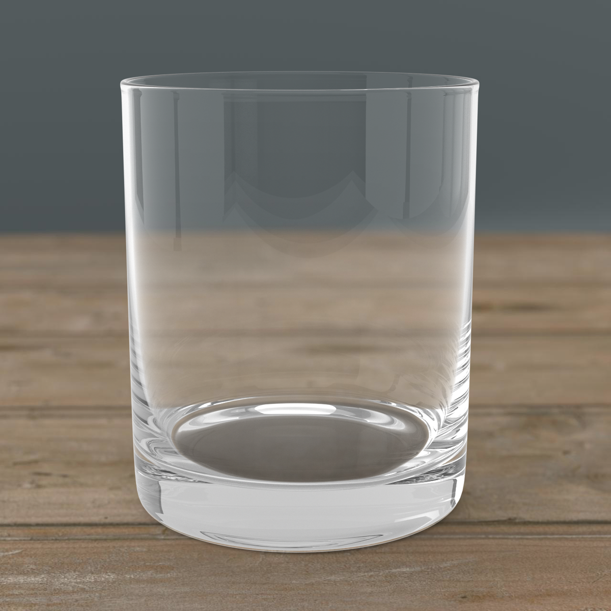 Laser engraved whiskey glass with alcohol-themed quote, set on bar cart